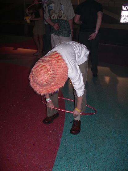 and look funny playing Hula-hoop