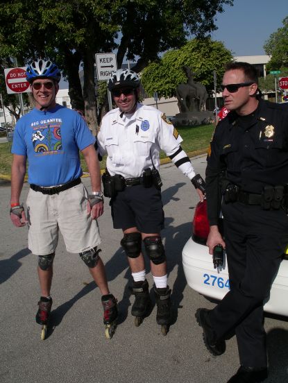 Dr Dan with our officer on skates, HEY I hope he got his five year shirt