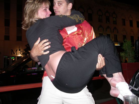 Once at O'Leary's, Cynthia jumps into John's arms...