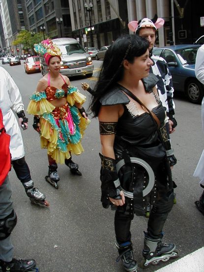 Xena Warrior Princess, may be powerful, but arriving on time is her bane. Carmine Miranda, in wonderful form, seems to slowly be losing her cha-cha's skating the Windy City in that sail of a dress.