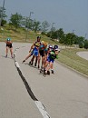 Nancy takes a flier as the pack follows Margo down and around the curve.