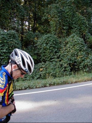 Tom checking to see if the Kudzu has started growing up his leg yet. Notice we are on maybe the flattest stretch of road on the course and it's still slanted up.