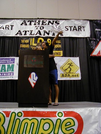 Eddy hugs Henry after receiving his winner's trophy from last year's race. Don't ask it's a long story.