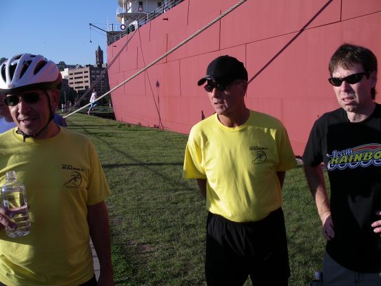 The men gather waiting for the kids sprints to start.
